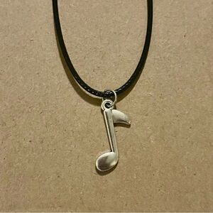 Silver Music Note Pendant Necklace on Black Cord